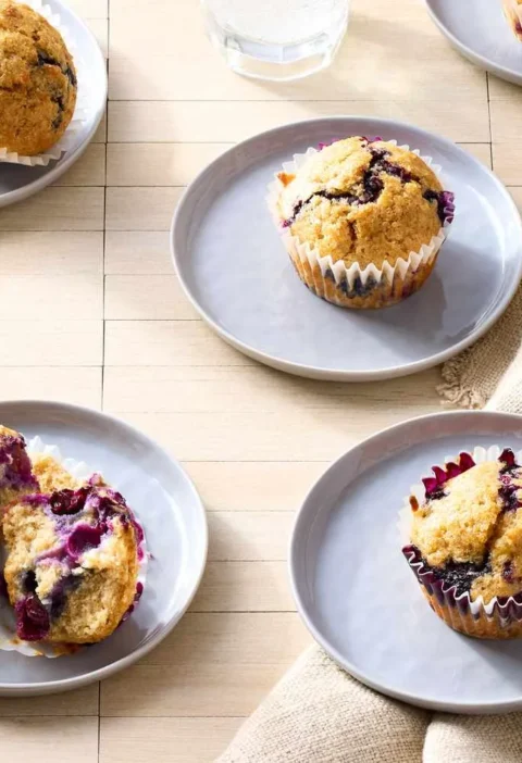 Martha Stewart vegan blueberry muffins with golden turbinado sugar crusts on a cooling rack