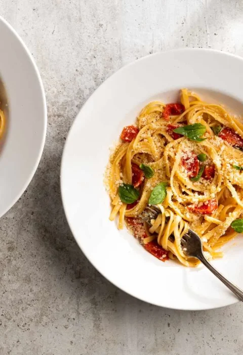 Martha Stewart one-pan pasta with cherry tomatoes, basil, and Parmesan in a skillet