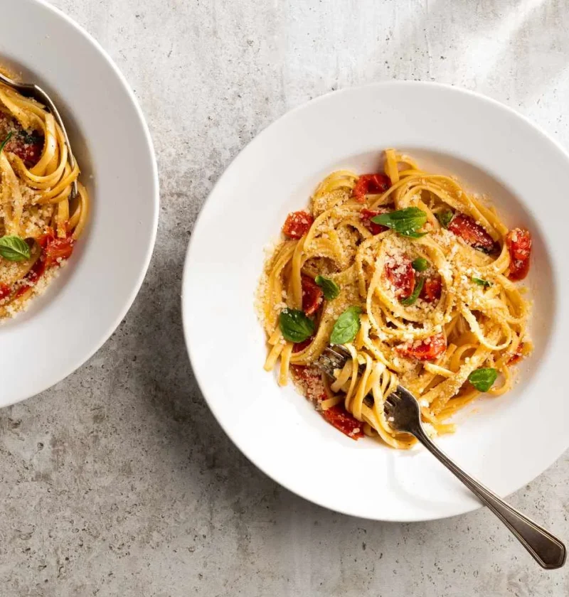 Martha Stewart one-pan pasta with cherry tomatoes, basil, and Parmesan in a skillet