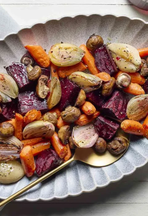 Oven-roasted carrots, beets, cremini mushrooms, and shallots caramelized on a sheet pan