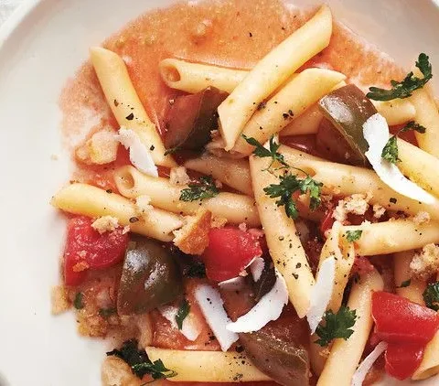 A plate of penne with tomatoes and parsley breadcrumbs, Martha Stewart style, topped with shaved ricotta salata