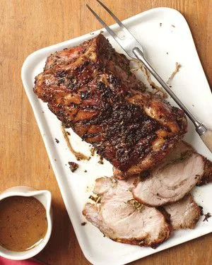 martha stewart roast pork with pan sauce on a serving platter