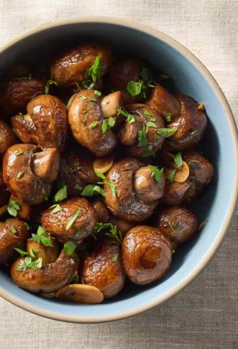 Sautéed cremini mushrooms with herbs, garlic, and butter in a skillet, Martha Stewart sautéed mushrooms with herbs recipe