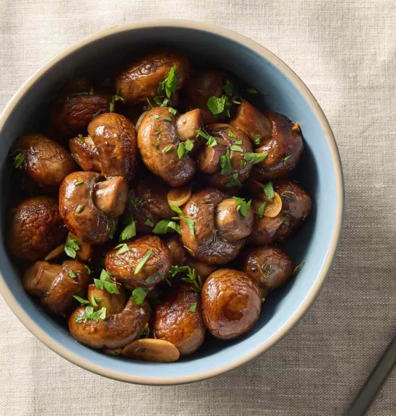 Sautéed cremini mushrooms with herbs, garlic, and butter in a skillet, Martha Stewart sautéed mushrooms with herbs recipe
