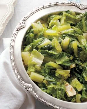 Martha Stewart sauteed romaine lettuce in a skillet with garlic and red pepper flakes