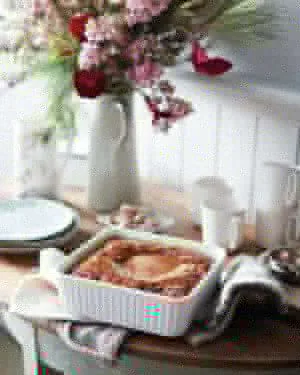 Martha Stewart Sticky Toffee Pudding With Toffee Sauce in a white baking dish