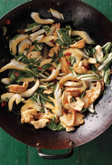 Stir-fried chicken strips with bok choy in a glossy soy-ginger sauce served over rice