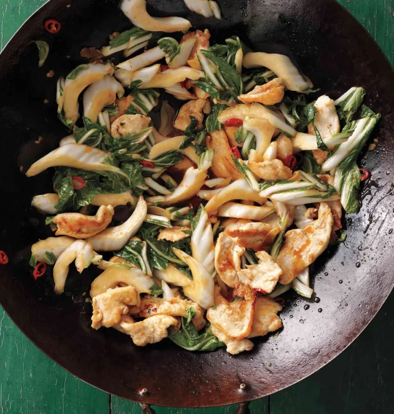 Stir-fried chicken strips with bok choy in a glossy soy-ginger sauce served over rice