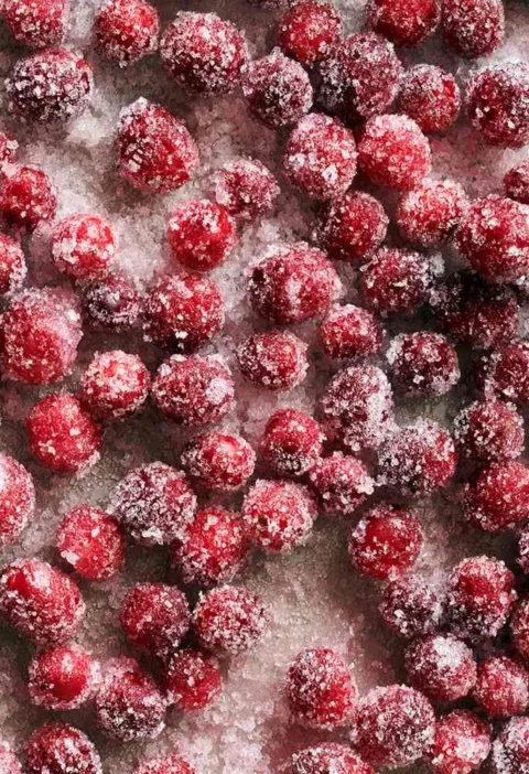 Sugared cranberries coated in sparkling sanding sugar, a Martha Stewart holiday garnish