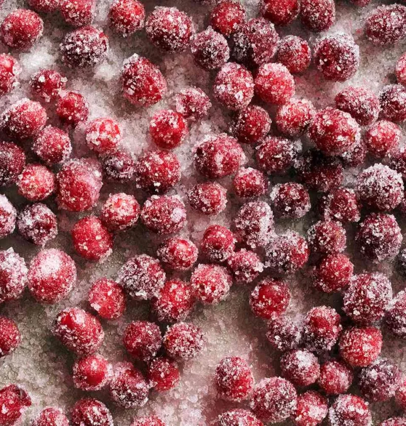 Sugared cranberries coated in sparkling sanding sugar, a Martha Stewart holiday garnish