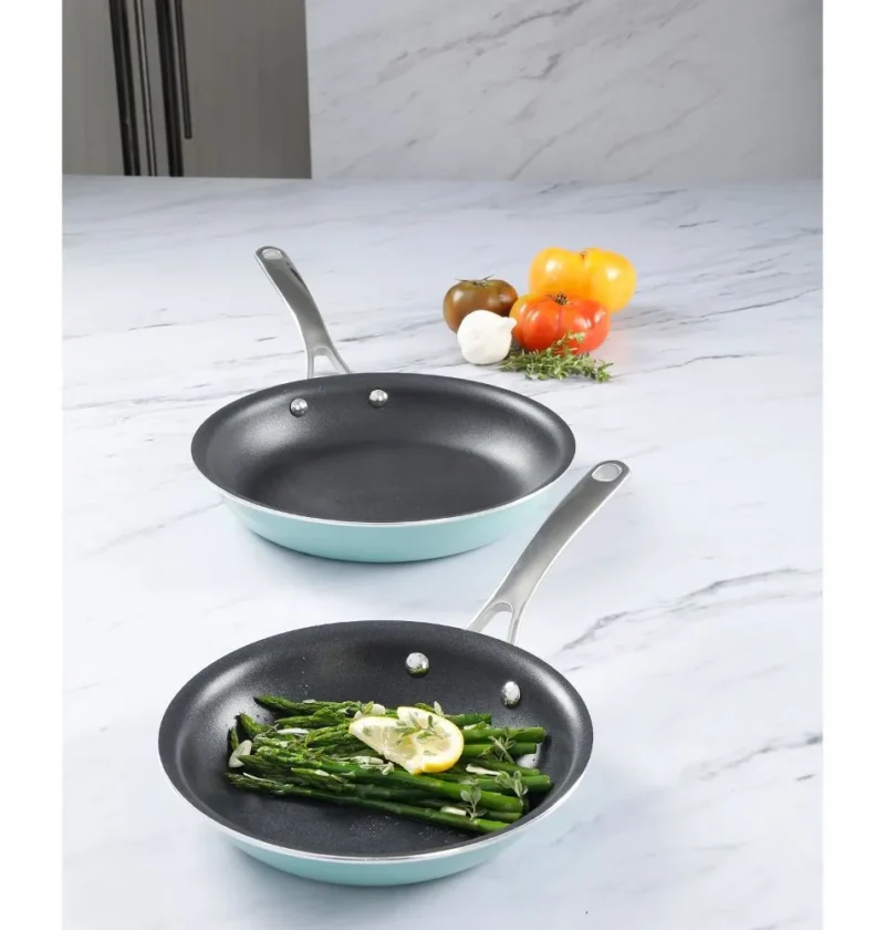 Martha Stewart asparagus vinaigrette: blanched asparagus spears with a lemon slice and fresh herbs in a nonstick skillet