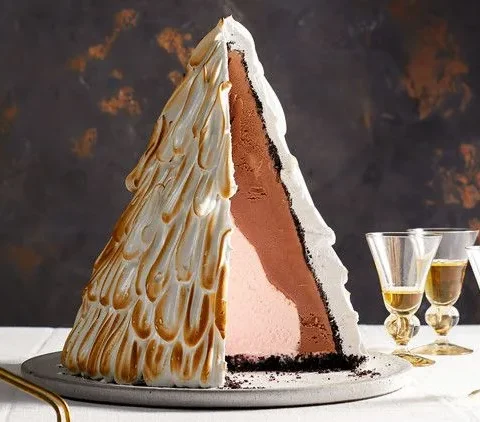 Martha Stewart baked-alaska tree with toasted meringue peaks sliced to show chocolate and peppermint ice cream layers