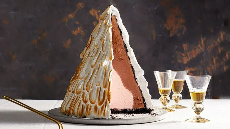 Martha Stewart baked-alaska tree with toasted meringue peaks sliced to show chocolate and peppermint ice cream layers