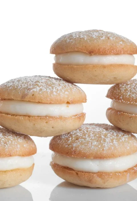 Martha Stewart banana whoopie pies stacked with cream cheese filling and dusted with confectioners' sugar