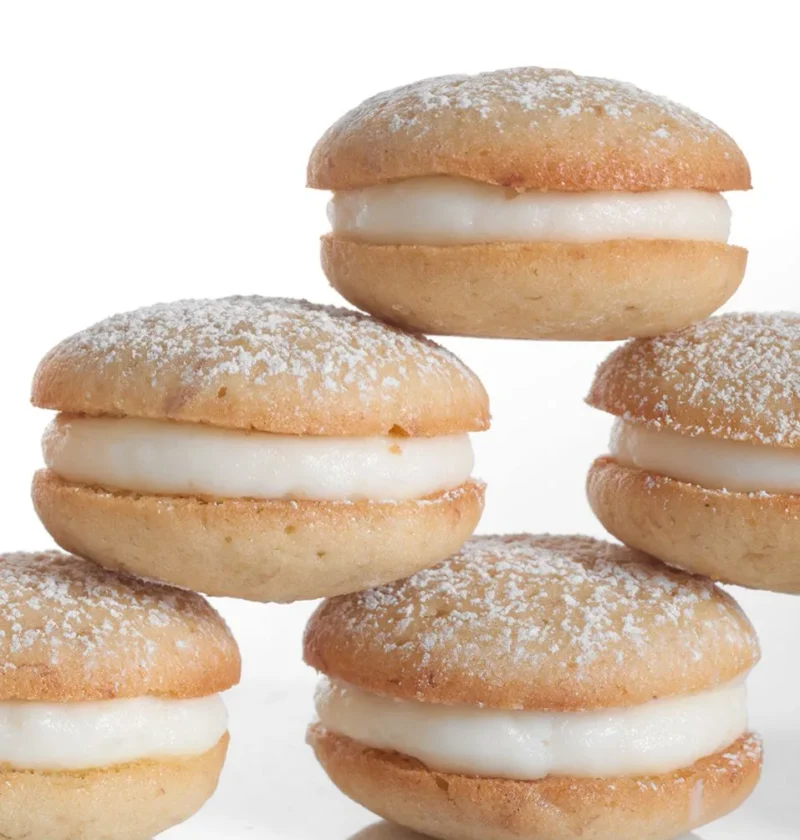 Martha Stewart banana whoopie pies stacked with cream cheese filling and dusted with confectioners' sugar