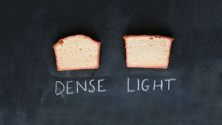 Martha Stewart best pound cake slices shown side by side, a dense version on the left and a light version on the right, on a chalkboard