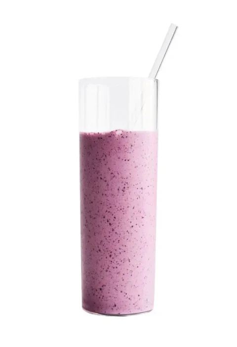 Martha Stewart blueberry-banana skyr smoothie in a tall glass with a glass straw