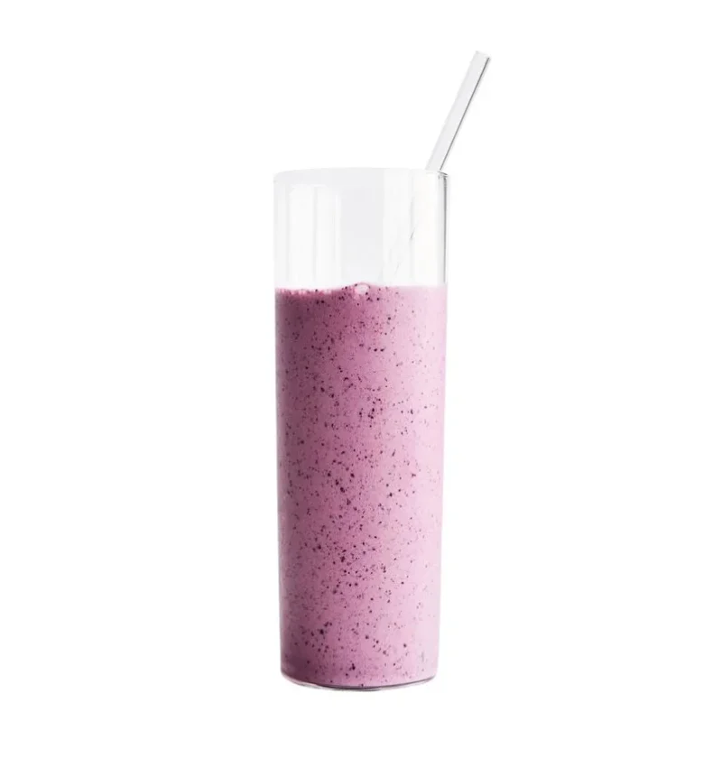 Martha Stewart blueberry-banana skyr smoothie in a tall glass with a glass straw