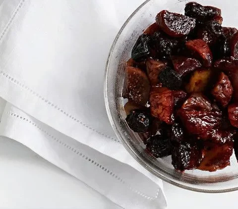 Martha Stewart boozy fruit, a glossy compote of port-soaked dried figs, apricots and pears in a clear glass bowl