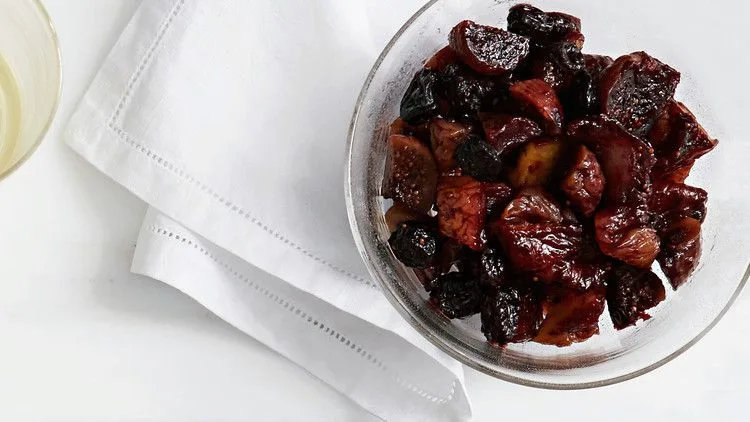 Martha Stewart boozy fruit, a glossy compote of port-soaked dried figs, apricots and pears in a clear glass bowl