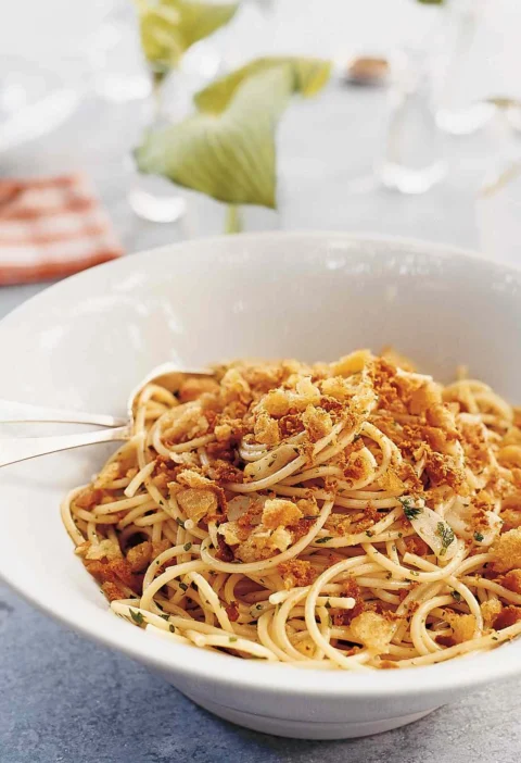 Martha Stewart bottarga pasta with golden breadcrumbs and parsley in a white bowl