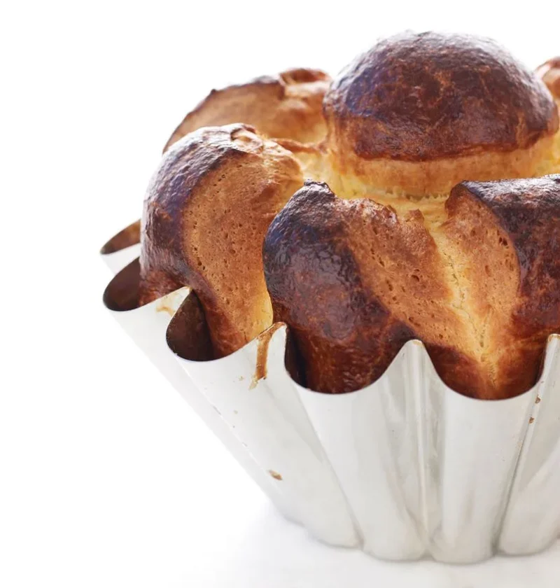 Martha Stewart brioche à tête, a golden fluted brioche loaf with a round head on top in a white fluted mold